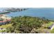 Scenic aerial view of the waterfront community surrounded by lush green trees and sparkling water at 2700 Bayshore Blvd # 512, Dunedin, FL 34698