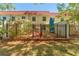 View of backyard patio with outdoor furniture and privacy fence at 2700 Bayshore Blvd # 512, Dunedin, FL 34698