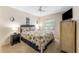 A primary bedroom features carpet, light color walls, and a TV at 2700 Bayshore Blvd # 512, Dunedin, FL 34698