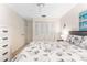 A primary bedroom features carpet, light-color walls, and a double closet at 2700 Bayshore Blvd # 512, Dunedin, FL 34698