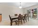 Dining room with sliding door access to backyard patio area at 2700 Bayshore Blvd # 512, Dunedin, FL 34698