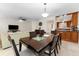 Open concept dining room with a modern table and stylish chandelier at 2700 Bayshore Blvd # 512, Dunedin, FL 34698