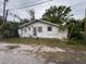 Quaint single-story home with weathered siding and a compact yard, offering a cozy and private living space at 3029 20Th St, St Petersburg, FL 33713