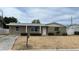 Charming exterior view of a single-story home showcasing a well-maintained lawn and landscaping at 3617 Winder Dr, Holiday, FL 34691