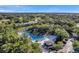 Aerial view of community pool area with lush greenery and a resort-style atmosphere for relaxation at 36750 Us 19 N # 2763, Palm Harbor, FL 34684