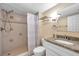 The bathroom features a tiled walk-in shower and granite countertops on the vanity sink at 36750 Us 19 N # 2763, Palm Harbor, FL 34684