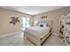 Light and airy bedroom with access to the outdoor patio through sliding glass doors at 36750 Us 19 N # 2763, Palm Harbor, FL 34684