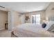 Bedroom featuring a bed, closet, and sliding glass door with access to the outdoor patio at 36750 Us 19 N # 2763, Palm Harbor, FL 34684