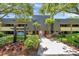 Attractive building exterior with mature landscaping and easy access to all units at 36750 Us 19 N # 2763, Palm Harbor, FL 34684