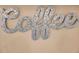 Decorative silver 'Coffee' signage displayed on a beige kitchen wall, adding a personal touch at 36750 Us 19 N # 2763, Palm Harbor, FL 34684