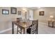 Cozy dining area with dark wood table and chairs with nearby door access at 36750 Us 19 N # 2763, Palm Harbor, FL 34684