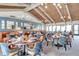 Upscale dining room with vaulted wood ceilings, mirrors, and tables set for service at 36750 Us 19 N # 2763, Palm Harbor, FL 34684