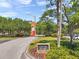 Entrance sign to Copperhead Clubhouse and Packard's Steakhouse with lush green landscaping at 36750 Us 19 N # 2763, Palm Harbor, FL 34684