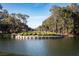 Scenic view of a golf course with a lake and manicured landscaping spelling out 