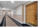 Hallway leading to unit entrance with carpet and painted walls at 36750 Us 19 N # 2763, Palm Harbor, FL 34684
