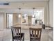 Kitchen view showcasing granite countertop bar with seating, white cabinets, and modern pendant lighting at 36750 Us 19 N # 2763, Palm Harbor, FL 34684