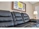 Comfortable living room with black leather couch and decor on the wall at 36750 Us 19 N # 2763, Palm Harbor, FL 34684