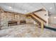 Lobby area with tile flooring, staircase, brick wall, and benches at 36750 Us 19 N # 2763, Palm Harbor, FL 34684