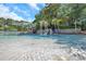 Luxurious pool featuring a rock waterfall and a waterslide offering a resort-style experience at 36750 Us 19 N # 2763, Palm Harbor, FL 34684