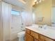 Practical bathroom with a vanity, mirror, and a combined shower-tub with a curtain at 4499 Chase Oaks Dr, Sarasota, FL 34241