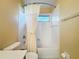Compact bathroom featuring a shower-tub combo with white tile and a single vanity at 4499 Chase Oaks Dr, Sarasota, FL 34241