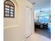 View of bedroom featuring a ceiling fan and a large arched window that brings in natural light at 4499 Chase Oaks Dr, Sarasota, FL 34241