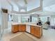 Spacious kitchen with a breakfast bar and a view into the main living space, perfect for entertaining guests at 4499 Chase Oaks Dr, Sarasota, FL 34241