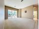 Spacious living room with sliding glass doors to a screened lanai, perfect for indoor/outdoor living at 4499 Chase Oaks Dr, Sarasota, FL 34241