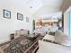 Open living area boasts vaulted ceilings and adjoins the kitchen, perfect for entertaining guests and Gathering at 4499 Chase Oaks Dr, Sarasota, FL 34241