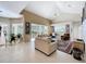 Spacious living area showcases natural light, tile floors, and neutral tones, ideal for relaxation and comfort at 4499 Chase Oaks Dr, Sarasota, FL 34241