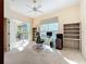 Spacious office area with a ceiling fan, an exterior view, and neutral carpeting at 4499 Chase Oaks Dr, Sarasota, FL 34241