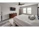 Bedroom showcasing an interior view with wood-look flooring, ceiling fan, and dresser at 5210 Dandelion St, Apollo Beach, FL 33572