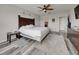 Bedroom features elegant decor, including a wood headboard and wood-look flooring at 5210 Dandelion St, Apollo Beach, FL 33572