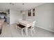 View of the dining room featuring natural lighting and a wood table set for four at 5210 Dandelion St, Apollo Beach, FL 33572