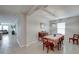 Open dining room with dining table and large window at 5210 Dandelion St, Apollo Beach, FL 33572