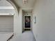 Covered front door with wreath at 5210 Dandelion St, Apollo Beach, FL 33572