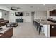 Spacious living room featuring tile flooring, a ceiling fan, and an entertainment center at 5210 Dandelion St, Apollo Beach, FL 33572