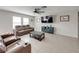 Bright living room with neutral paint and tan furniture with views to the exterior at 5210 Dandelion St, Apollo Beach, FL 33572