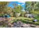 View of a spacious backyard with mature trees and shed at 57 Hamilton Heath Dr Dr, Tampa, FL 33604