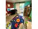 Home office featuring a barn door, colorful rug and adjacent bathroom at 6036 Florida Ave, New Port Richey, FL 34653