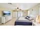 Bright bedroom with ceramic tile floors, neutral walls, a ceiling fan, and a view to the outside at 6418 Austrian Blvd, Punta Gorda, FL 33982
