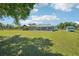 View of the home with screened-in pool, gazebo, and shed at 6418 Austrian Blvd, Punta Gorda, FL 33982