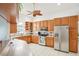Bright and functional kitchen with stainless steel appliances and wood cabinets at 6418 Austrian Blvd, Punta Gorda, FL 33982