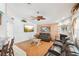 Cozy living room with stone fireplace, leather seating, and laminate floors at 6418 Austrian Blvd, Punta Gorda, FL 33982