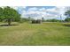Vast green pasture with an open shelter promises ample space for grazing and outdoor activities at 6418 Austrian Blvd, Punta Gorda, FL 33982