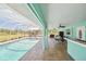 An outdoor pool and lanai overlooking fenced pastures at 6418 Austrian Blvd, Punta Gorda, FL 33982