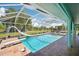 Inviting screened-in pool with slide and diving board for summer fun at 6418 Austrian Blvd, Punta Gorda, FL 33982