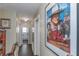 Hallway with a large John Wayne picture at the end at 6754 Ralston Beach Cir, Tampa, FL 33614