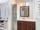Bathroom featuring a storage cabinet and updated sink at 7303 N Branch Ave, Tampa, FL 33604