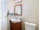 Bathroom with a vanity, mirror, and toilet at 7303 N Branch Ave, Tampa, FL 33604